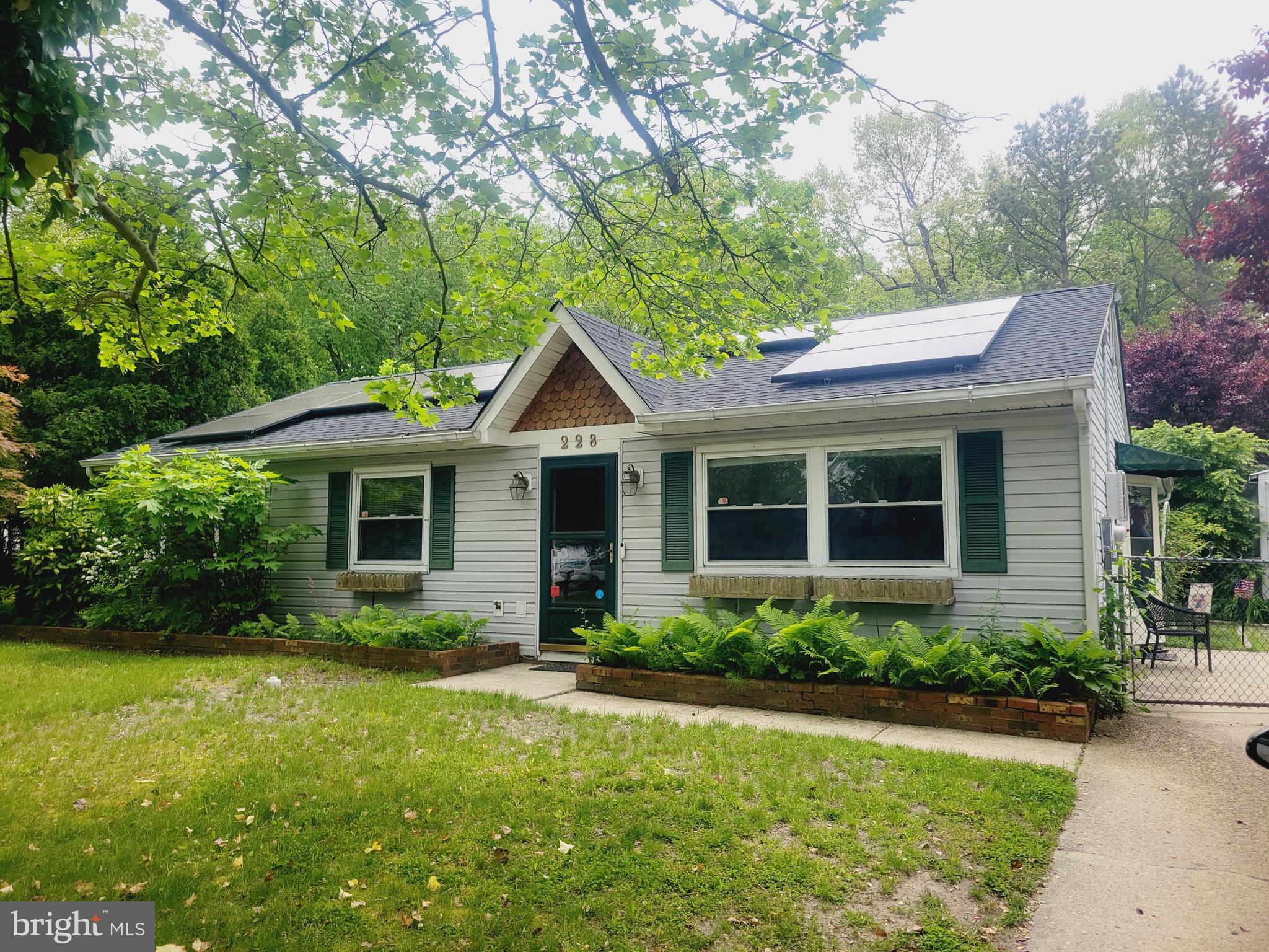 a front view of a house with a yard and porch