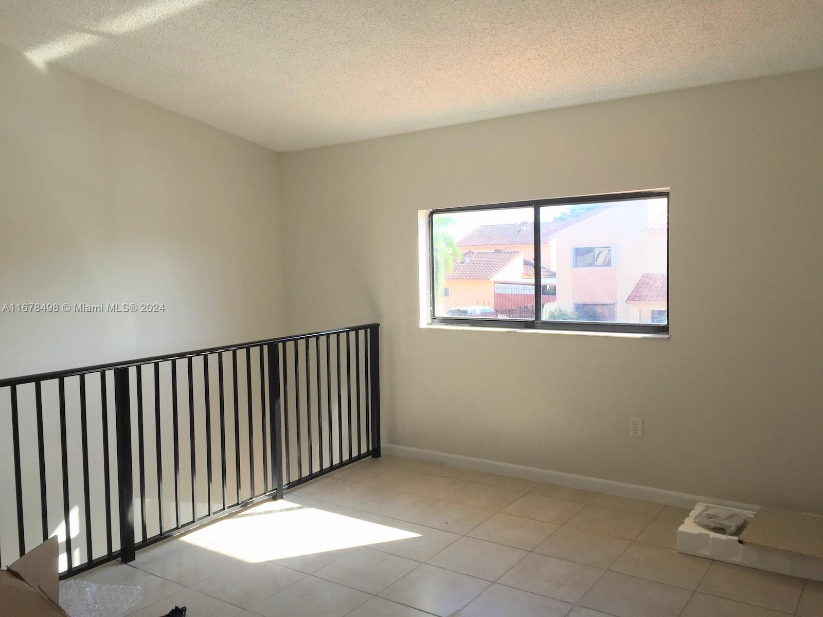 a view of a hallway with a window