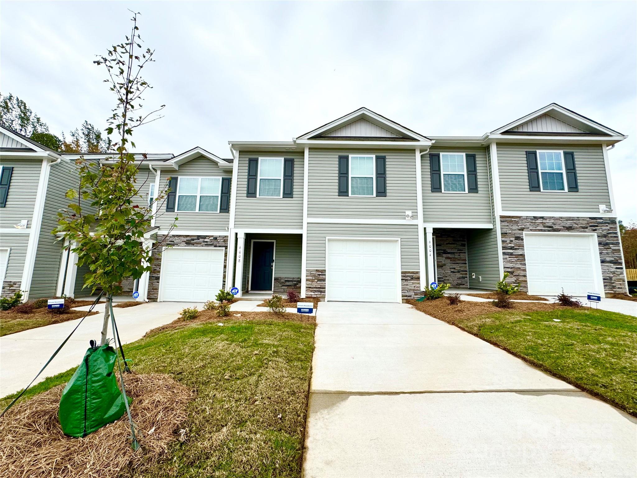 a front view of a house with yard