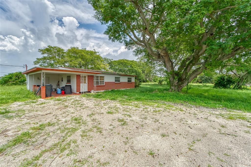 a view of a house with a yard