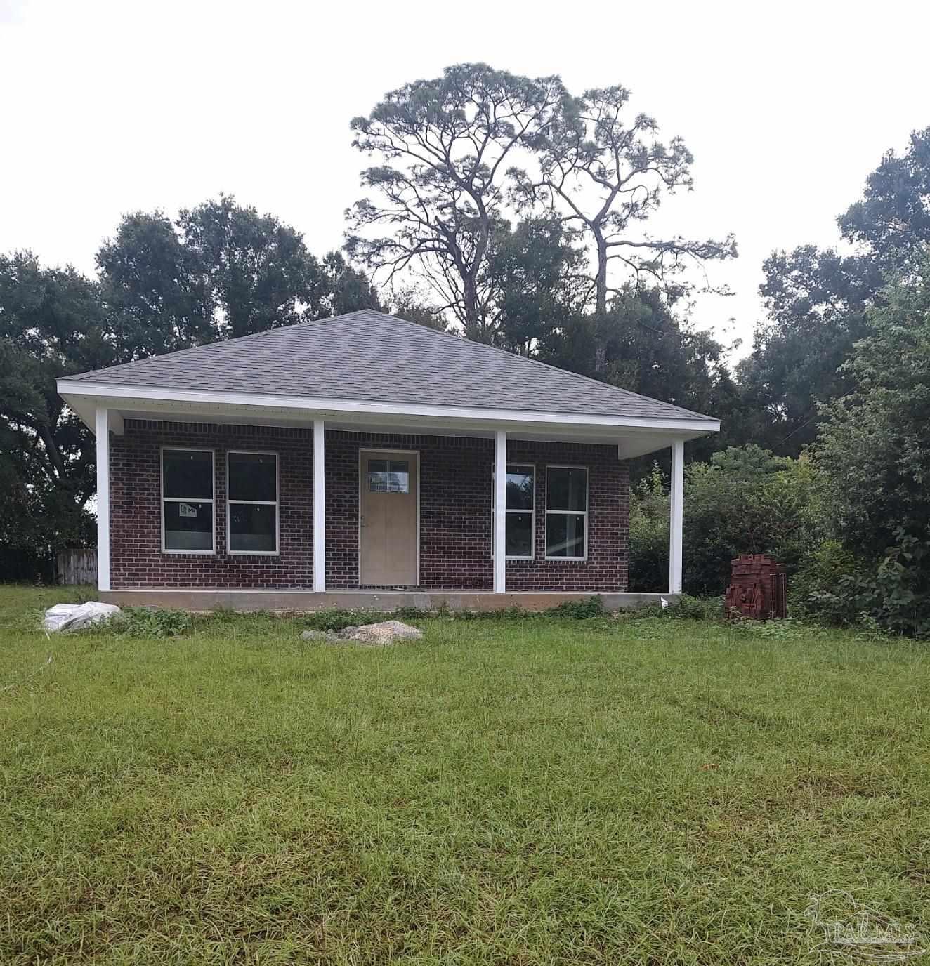 front view of a house with a garden