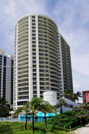 a front view of a building with garden