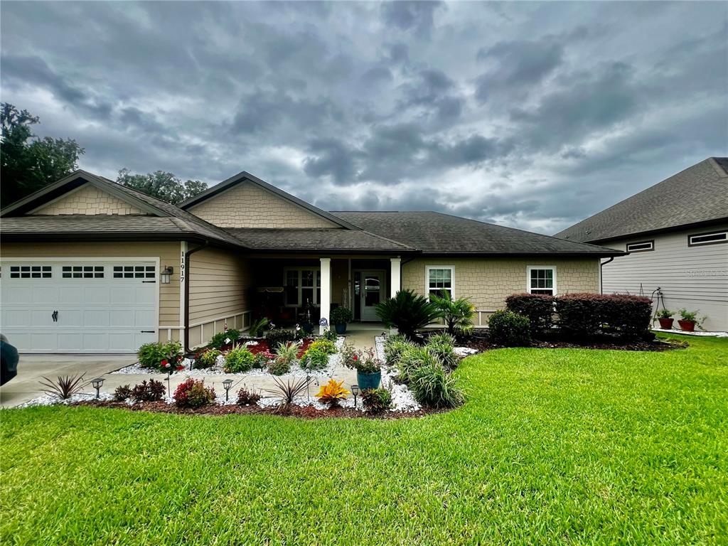 a front view of a house with garden