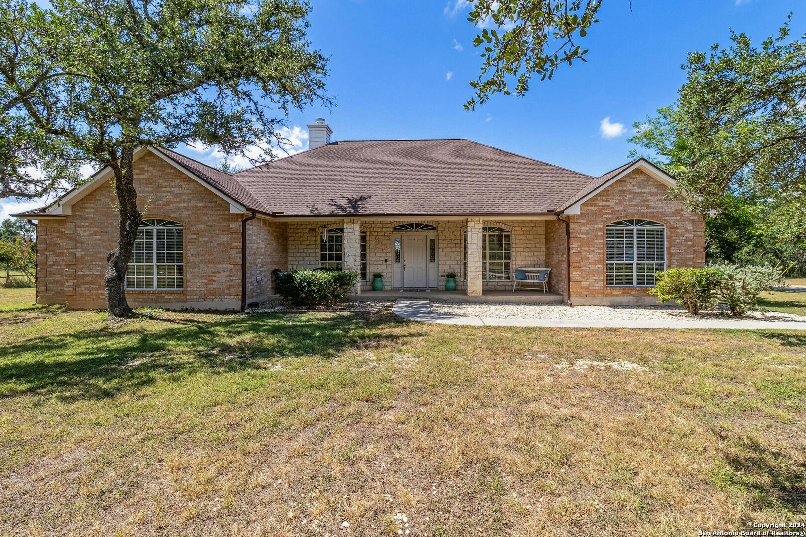 a house with trees in the background