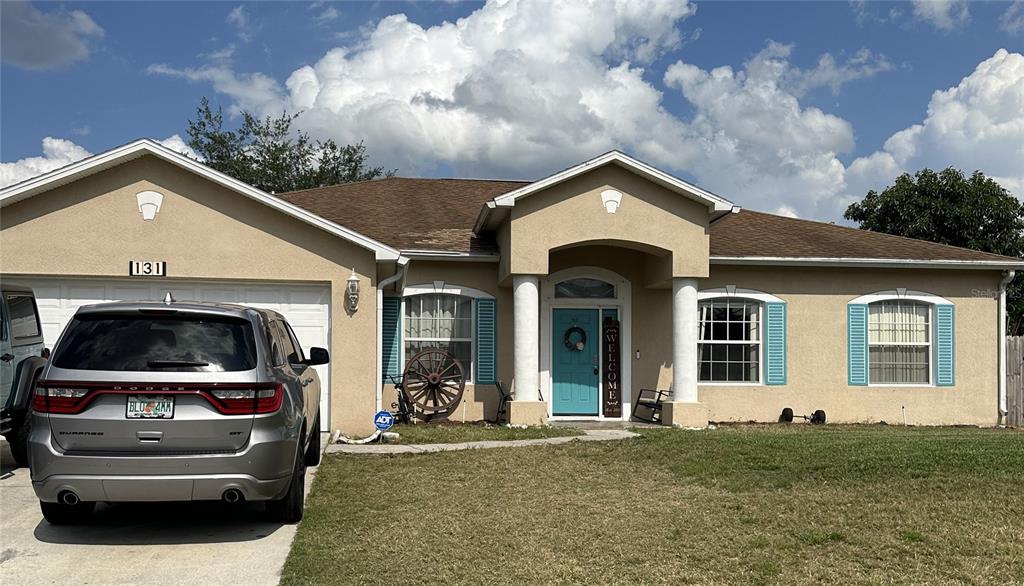 a view of a car in front of house