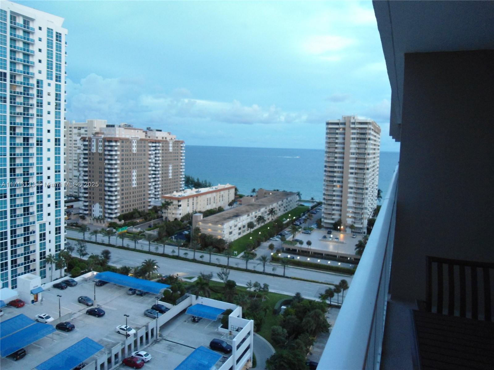 a view of roof with city view