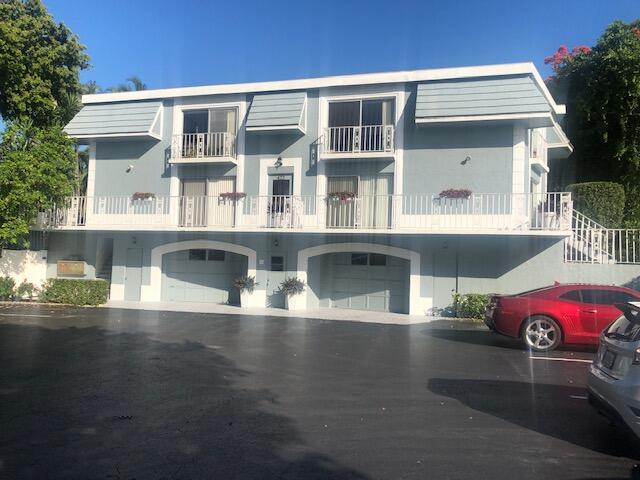 a front view of a house with parking