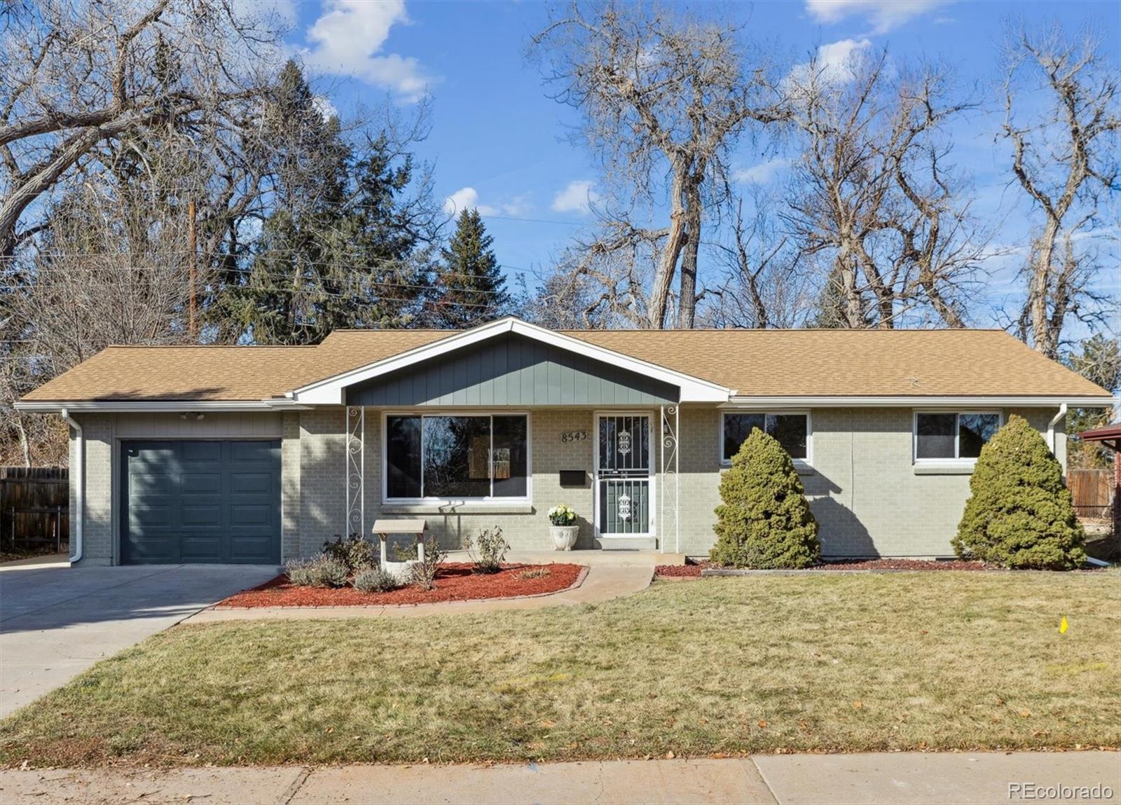 front view of a house with a yard