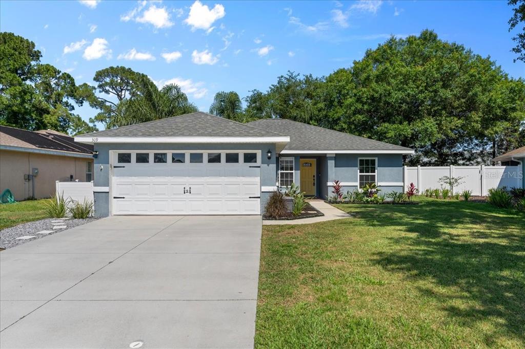 front view of a house with a yard