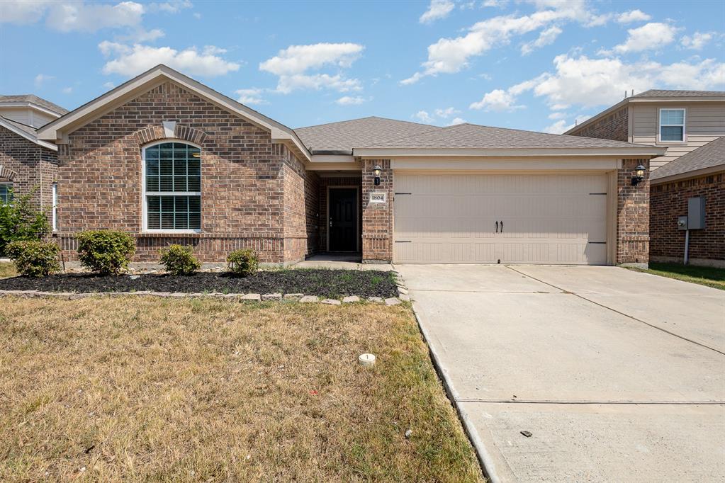 a front view of a house with yard