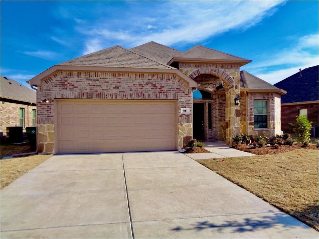 a front view of a house with yard