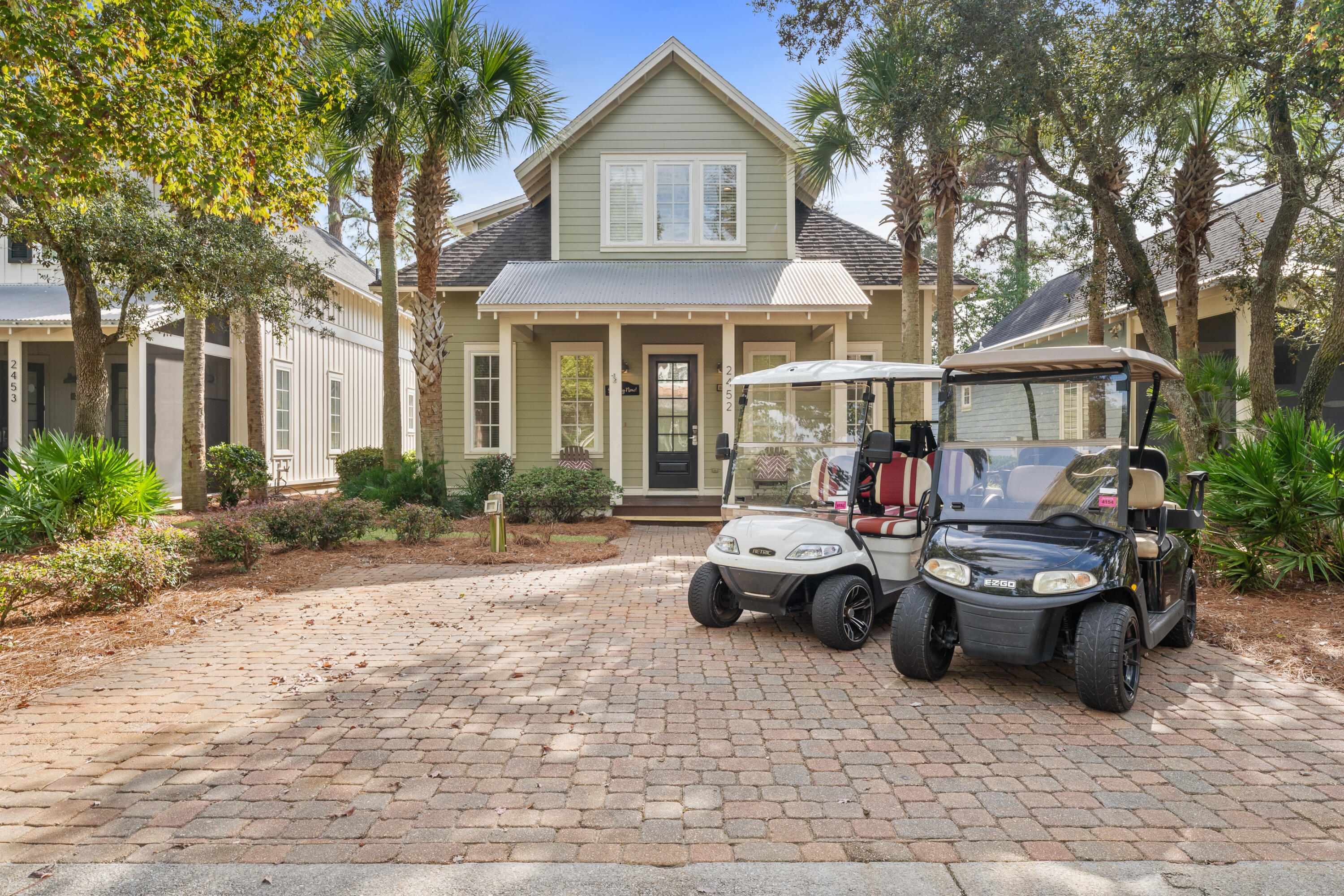 a front view of a house with parking space