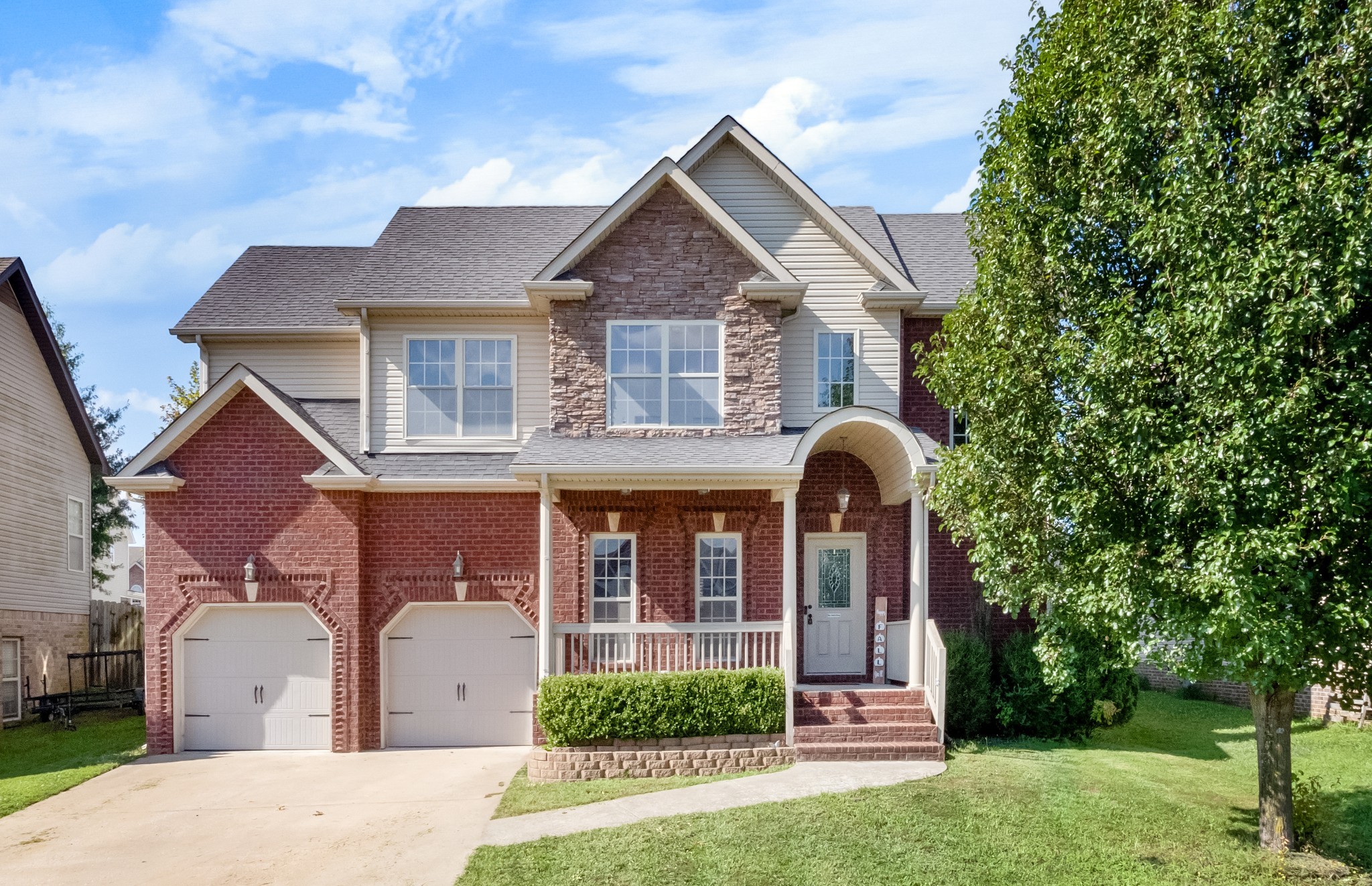 front view of a house with a yard