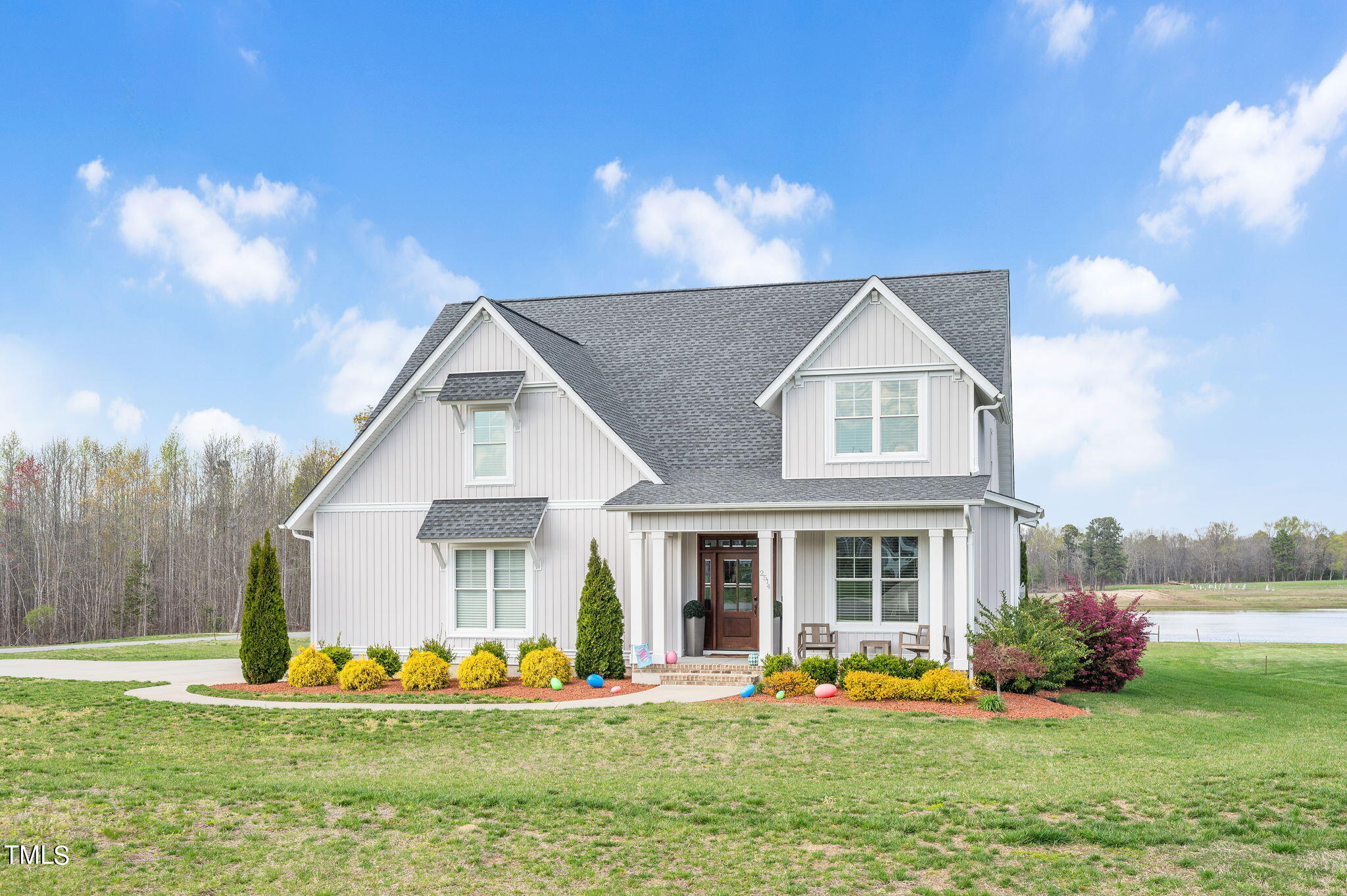 a front view of house with yard and green space