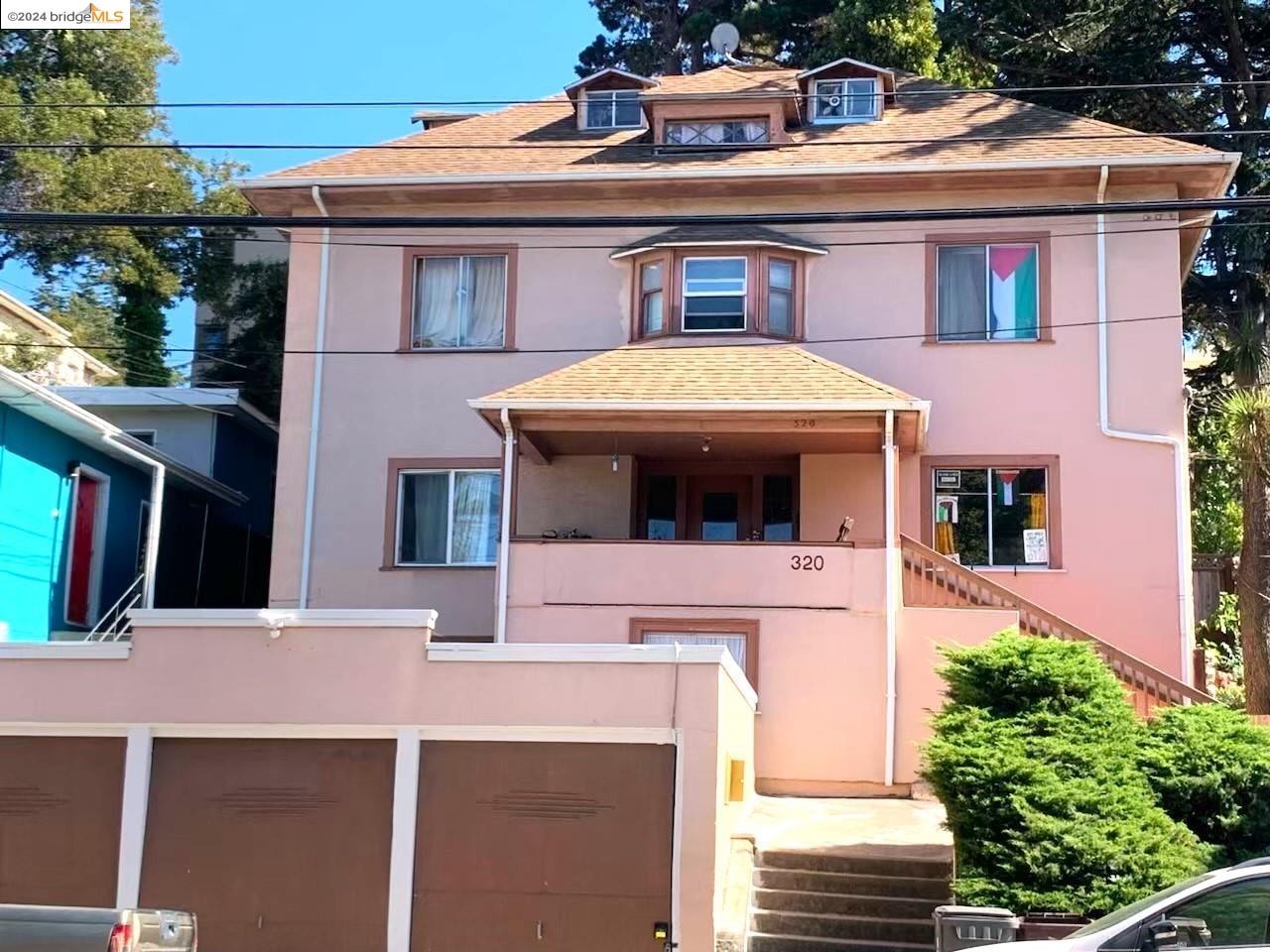 a view of a house with a balcony and garage