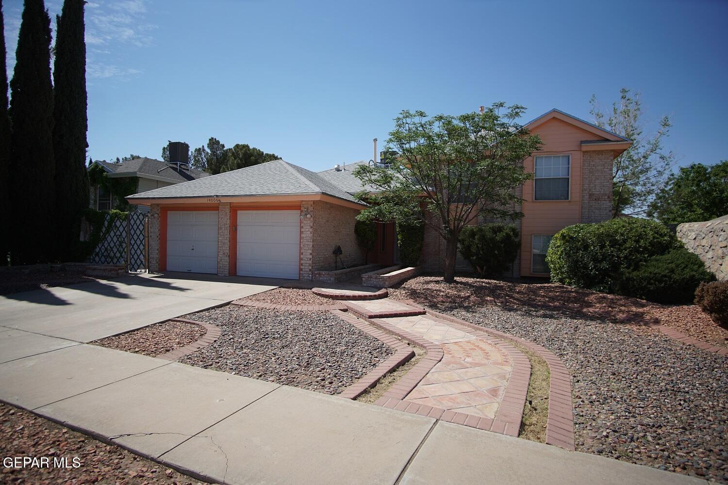 a front view of a house with yard