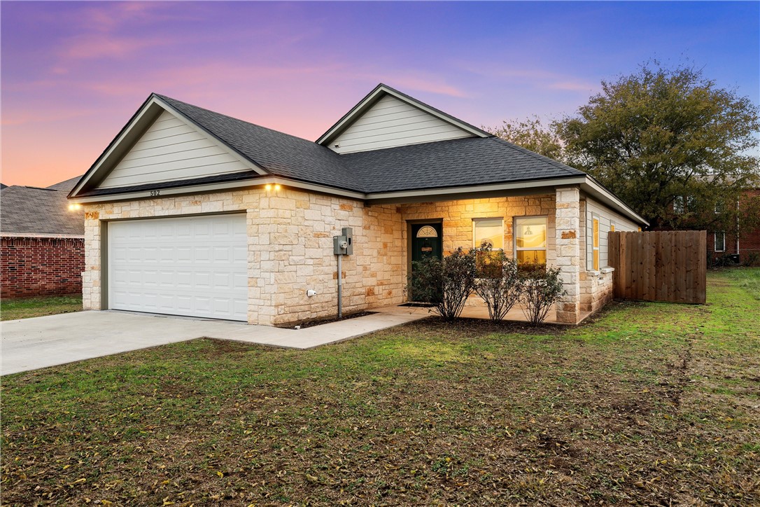 a front view of a house with yard