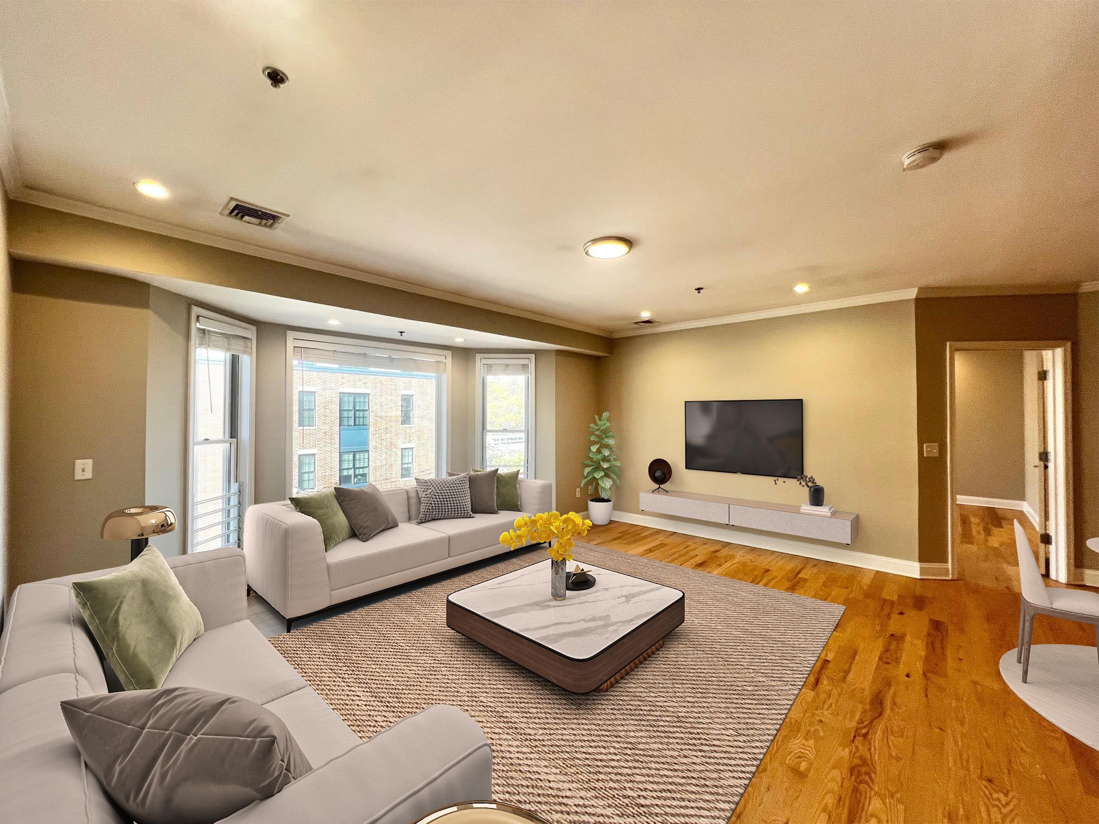 a living room with furniture and a flat screen tv