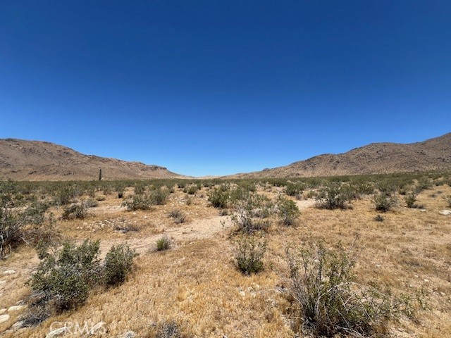 a view of mountain view with mountains in the background