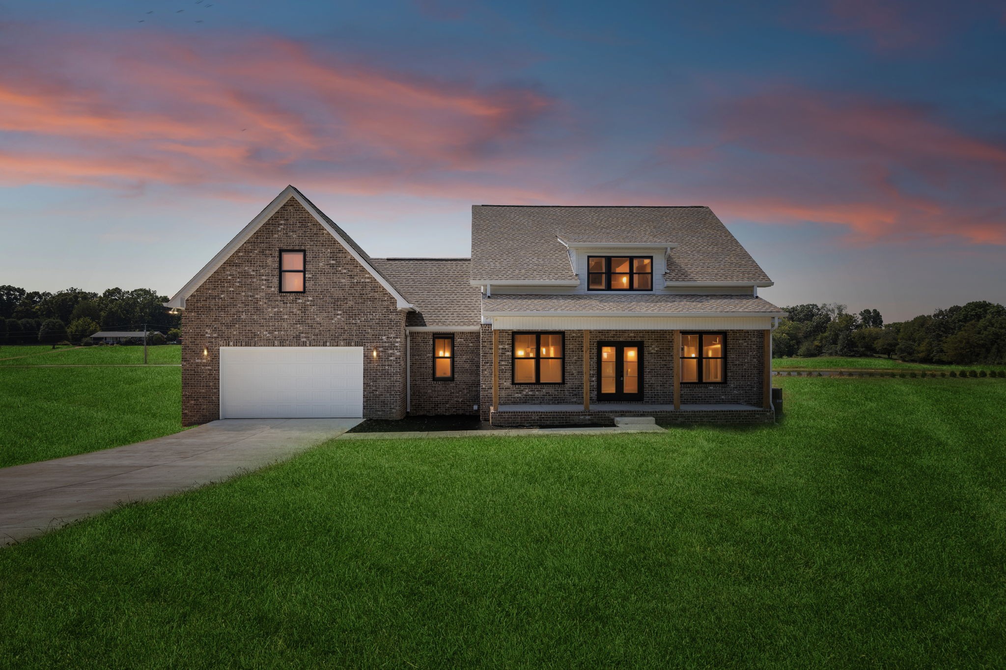 a front view of a house with a yard