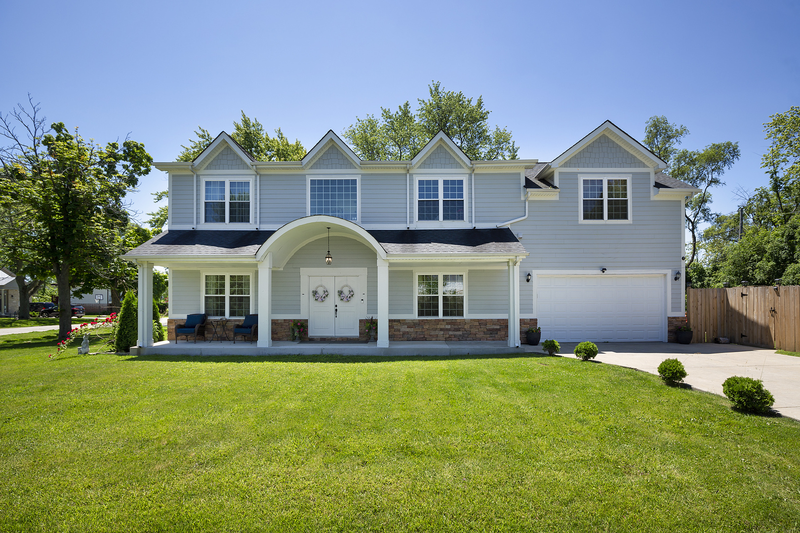 a front view of house with yard and green space