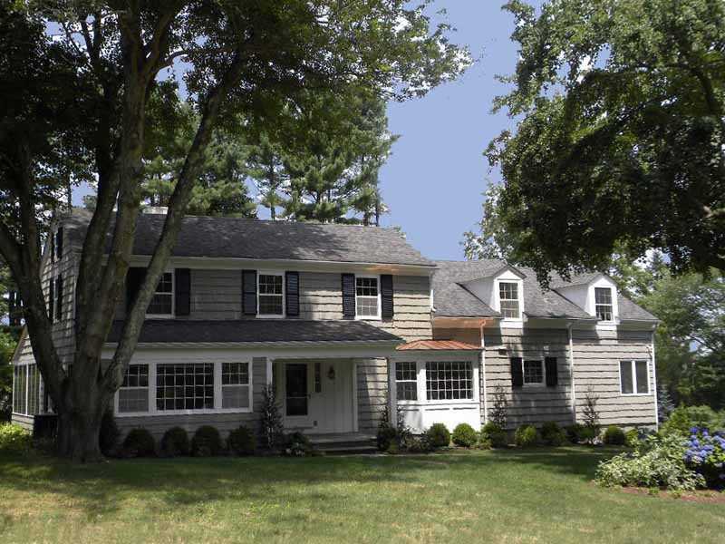 front view of a house with a yard