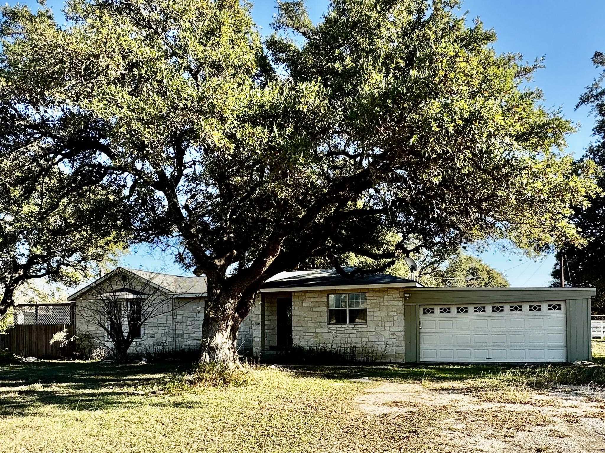 a view of house with yard