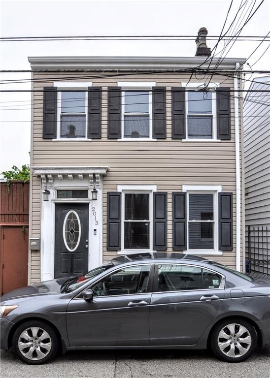 a front view of a house with parking space