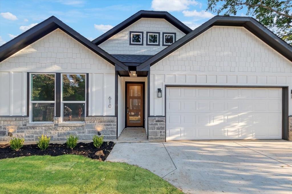 front view of a house with a yard