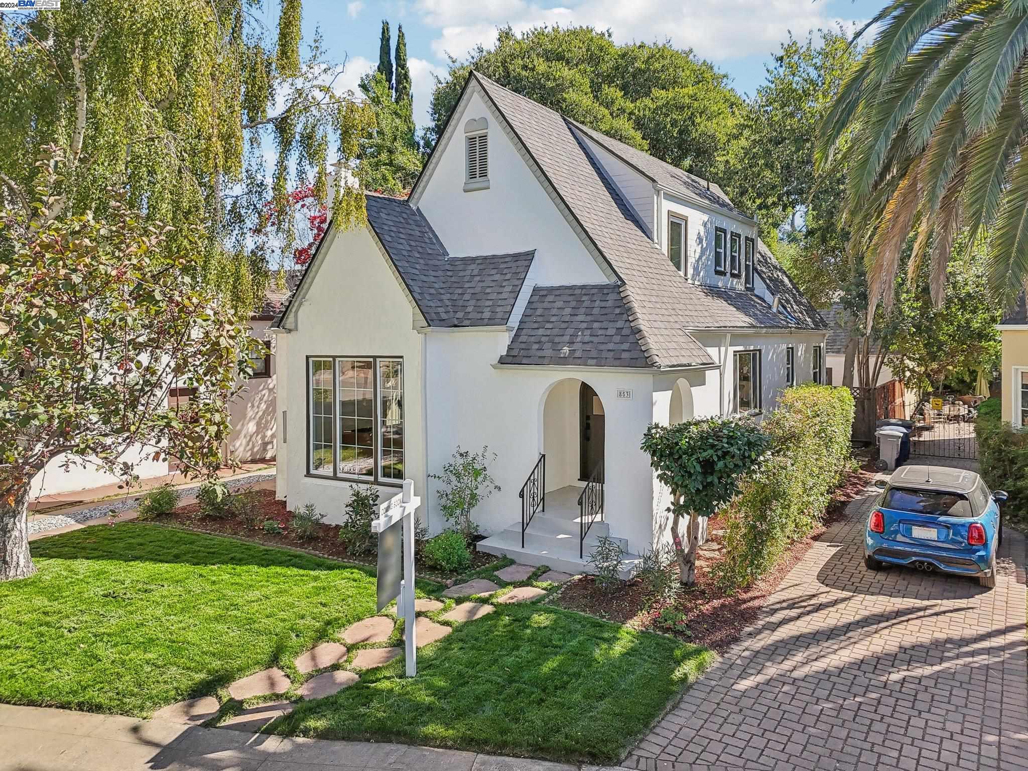 a front view of a house with garden