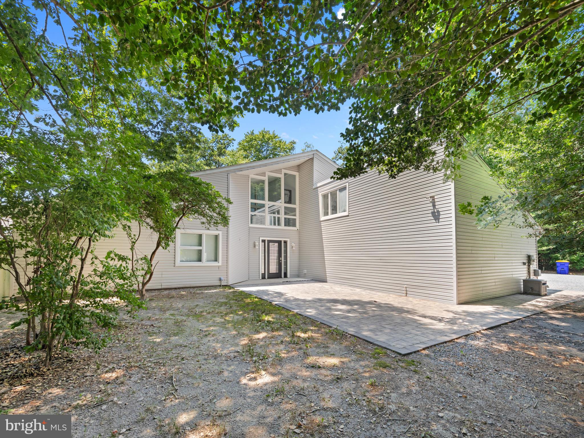 front view of a house with a tree