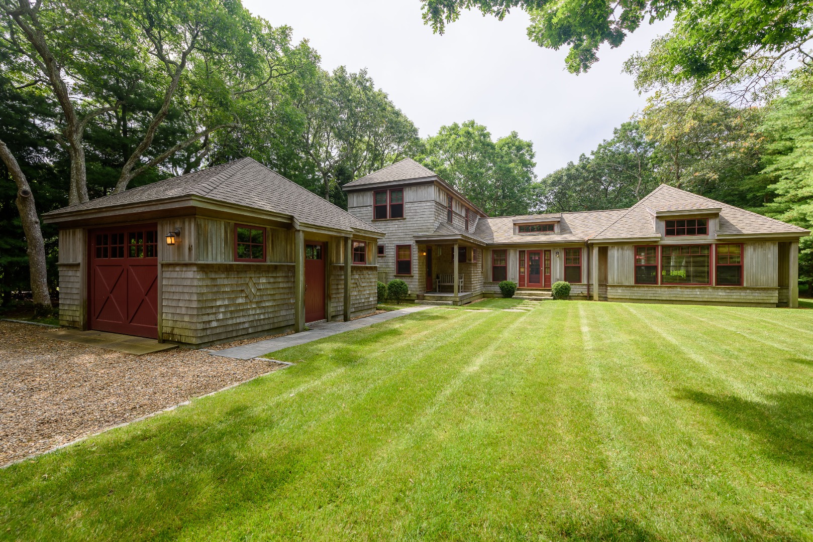 a front view of a house with a garden