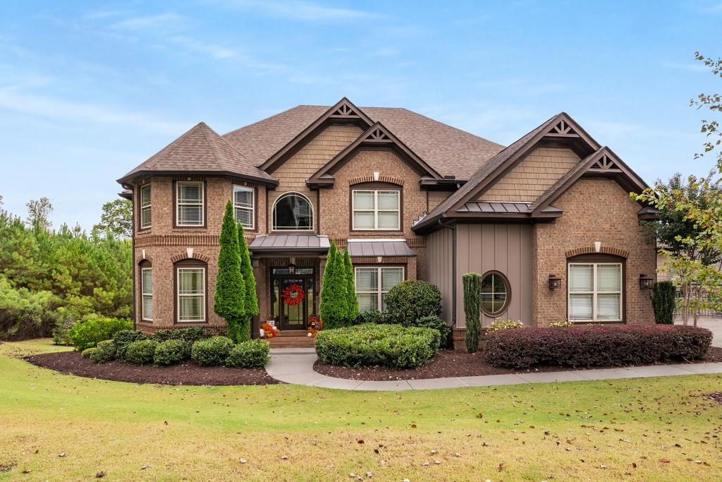 a front view of a house with garden