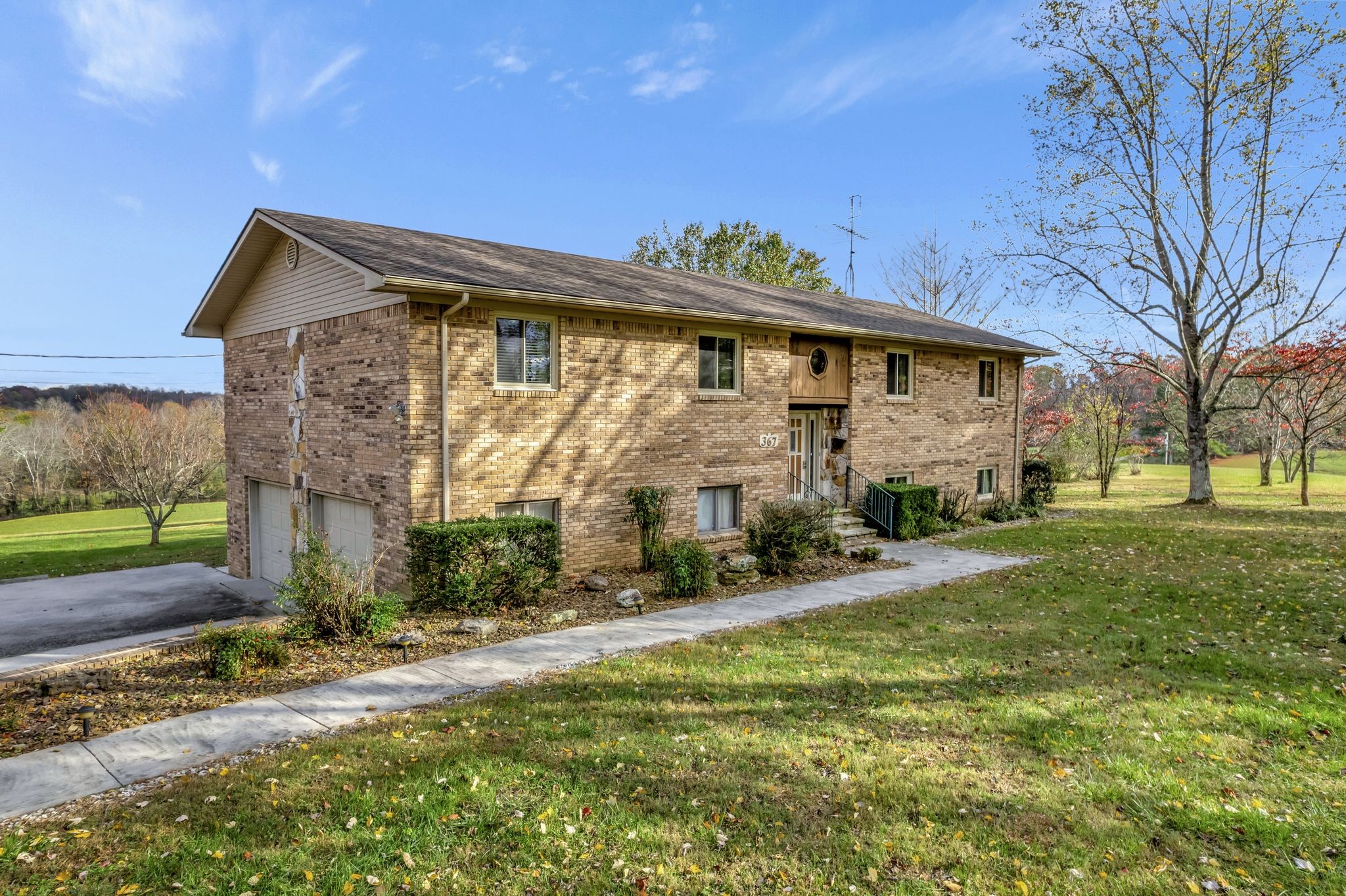 a front view of a house with a yard