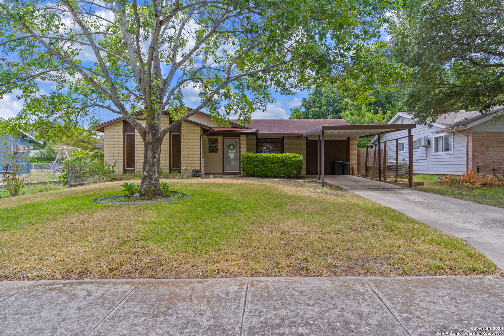 front view of a house with a yard