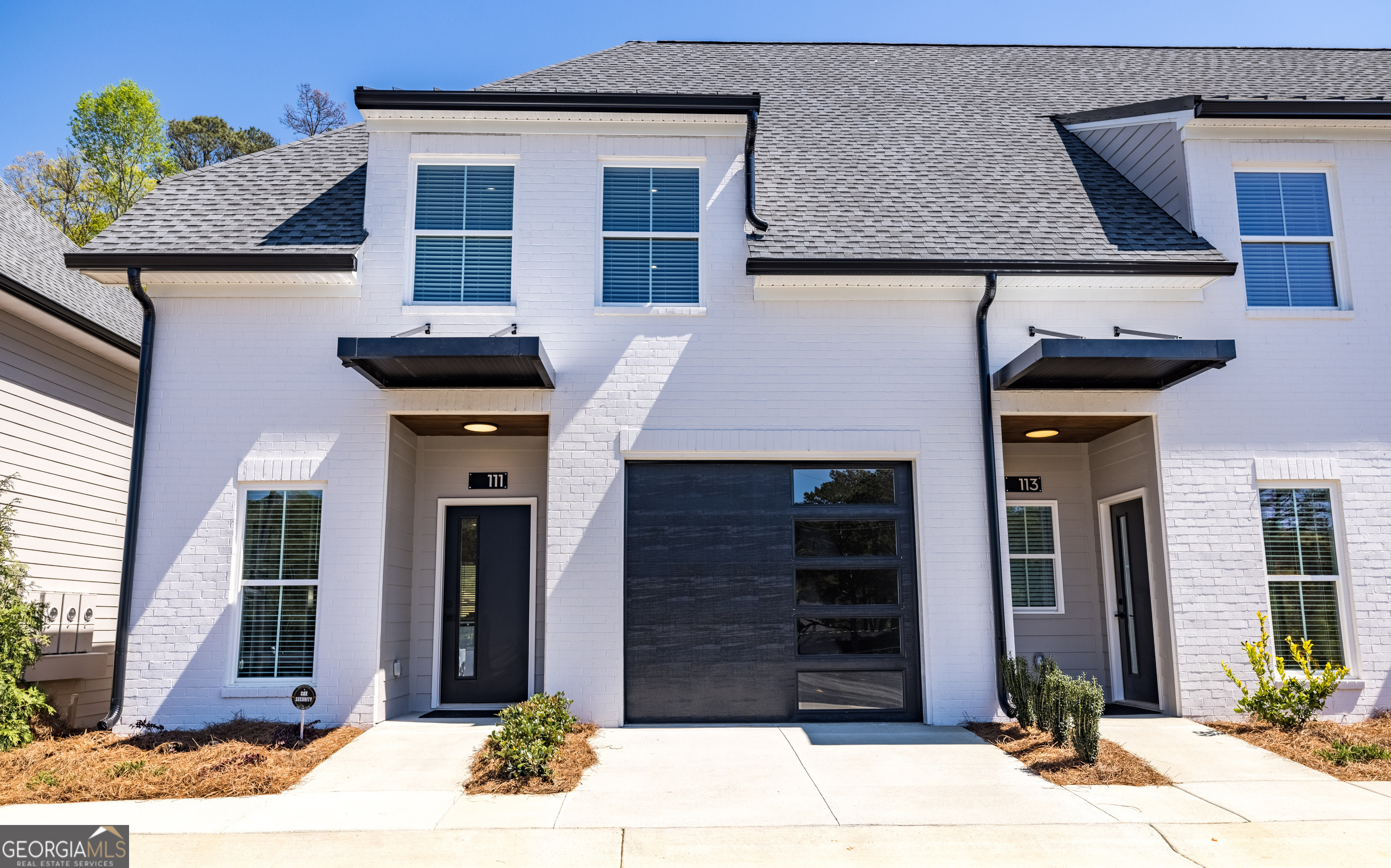 a front view of a house with a garage