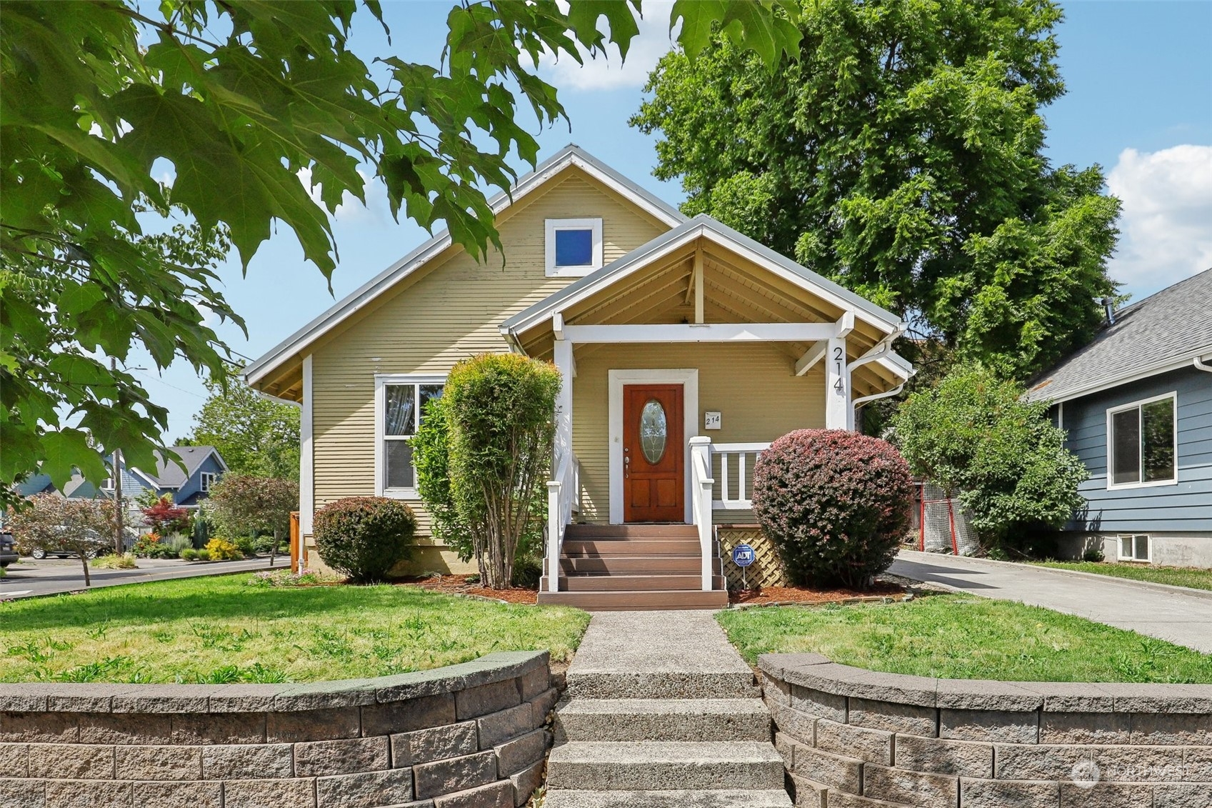 a front view of a house with garden