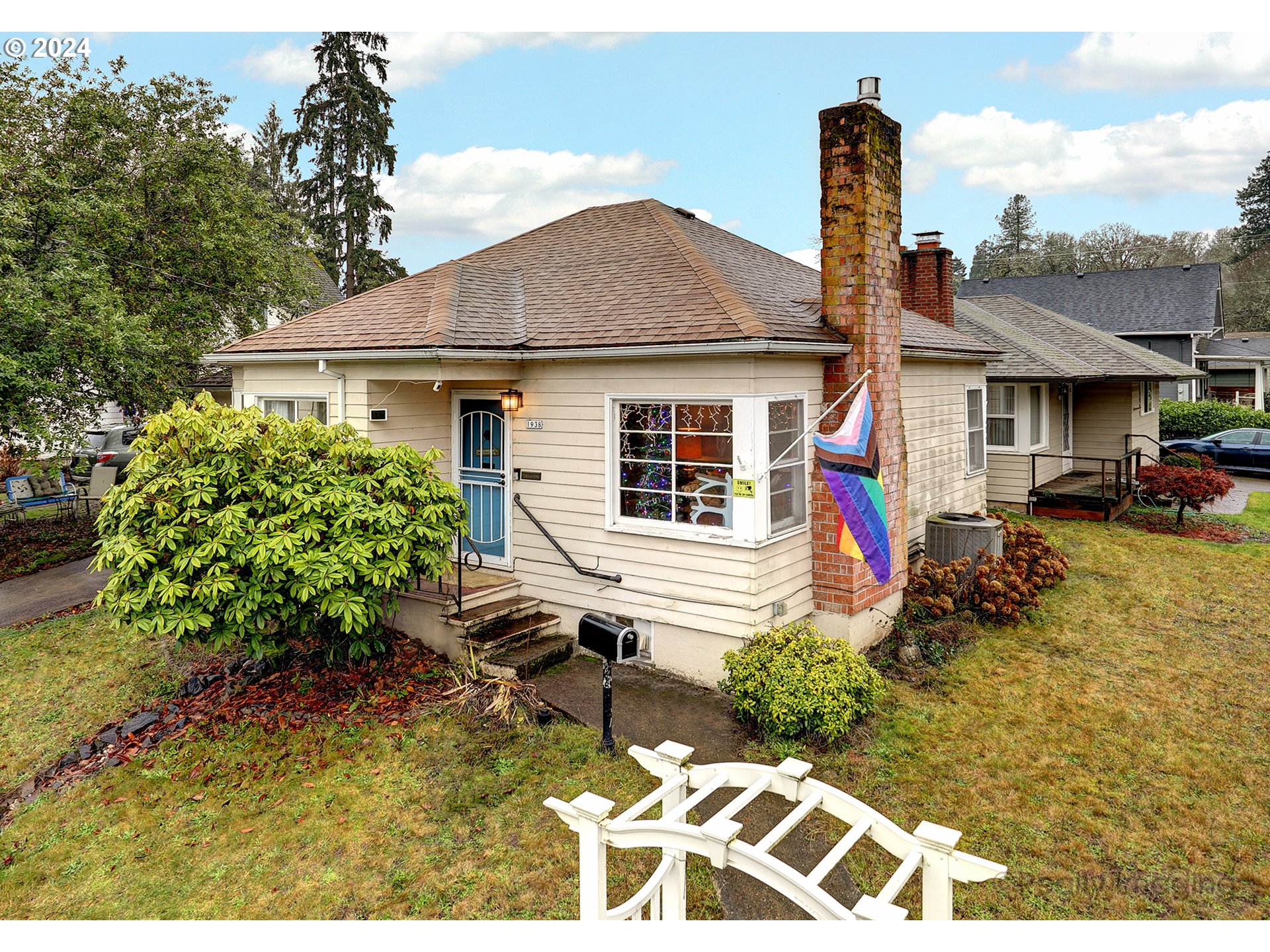 a front view of a house with garden