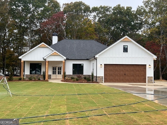 a front view of a house with yard and green space