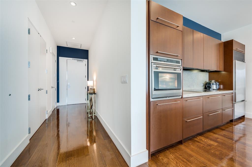 a kitchen with cabinets a sink and appliances