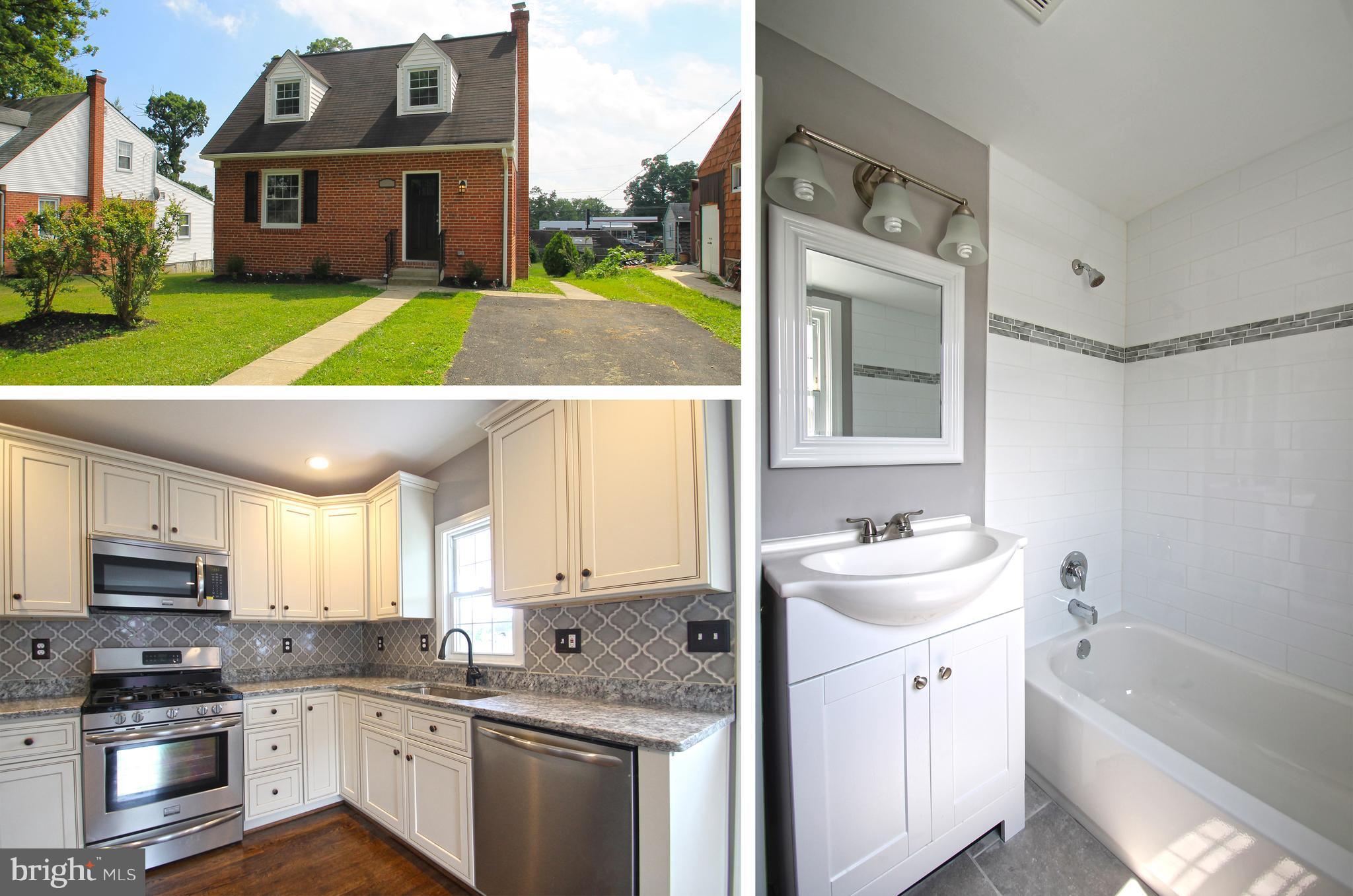 a kitchen with stainless steel appliances granite countertop a sink and cabinets