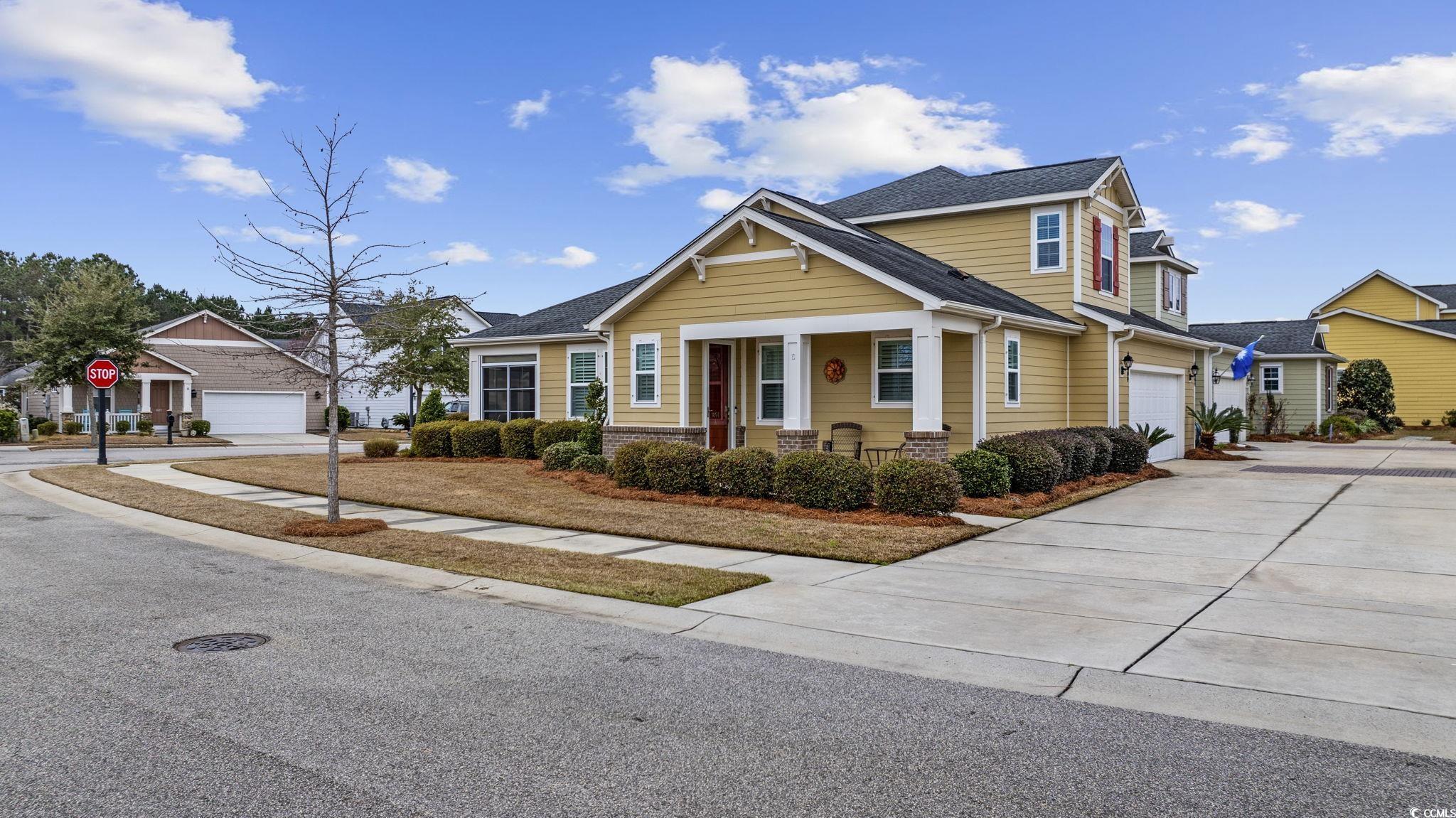 Craftsman-style home featuring a garage, a residen