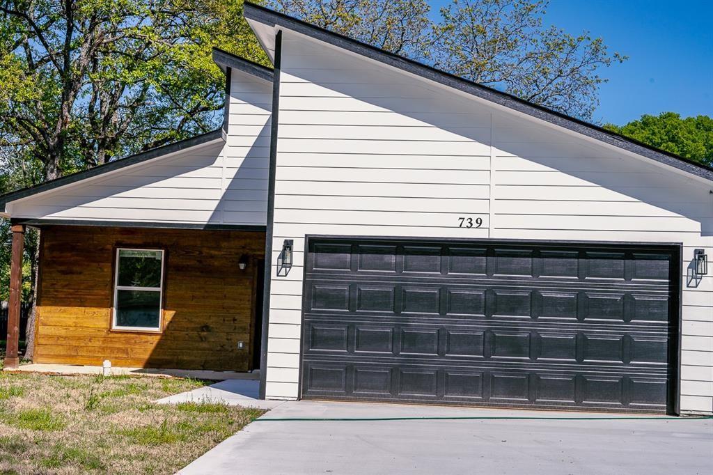 a front view of a house with garage