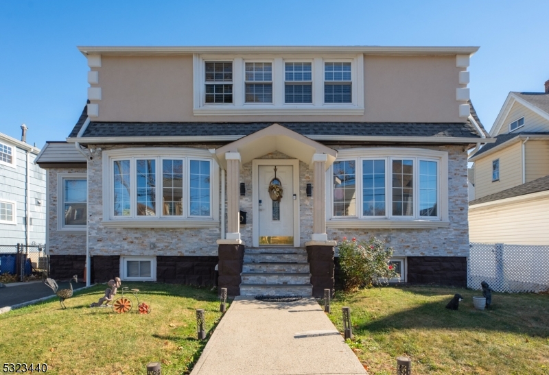 a front view of a house with swimming pool