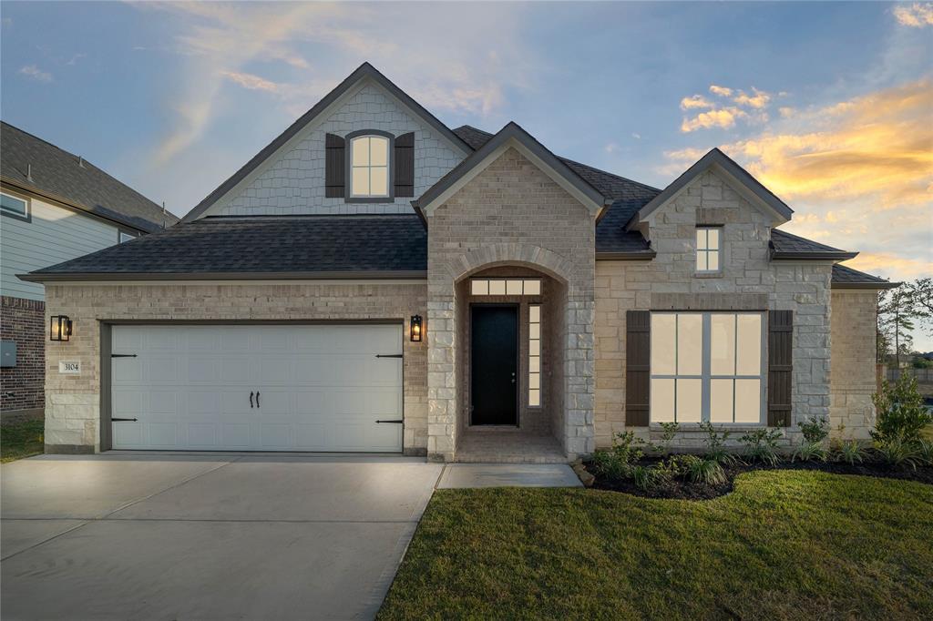 Welcome home to 3104 Red Buckeye Lane located in Barton Creek Ranch and zoned to Conroe ISD.