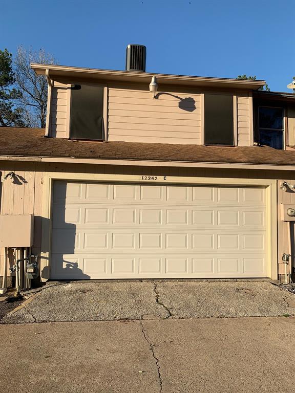 a front view of a house with a garage