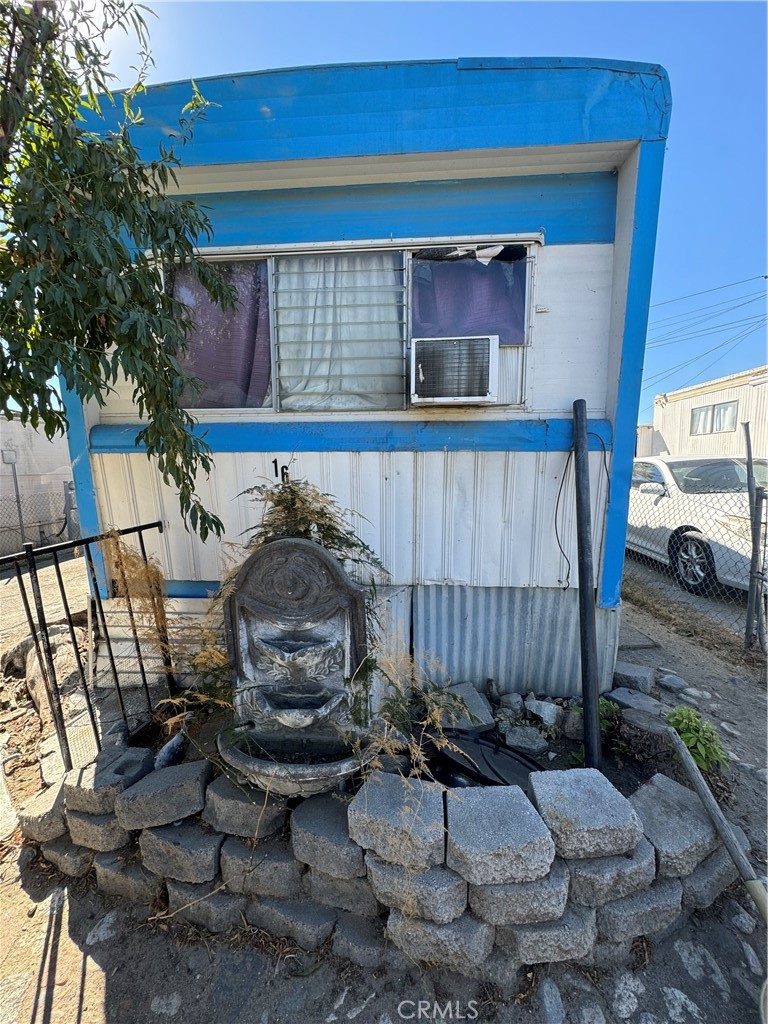 a view of a chairs and table in backyard