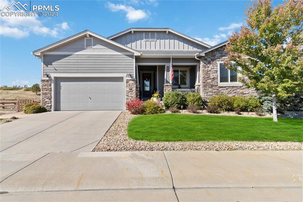 front view of a house with a yard