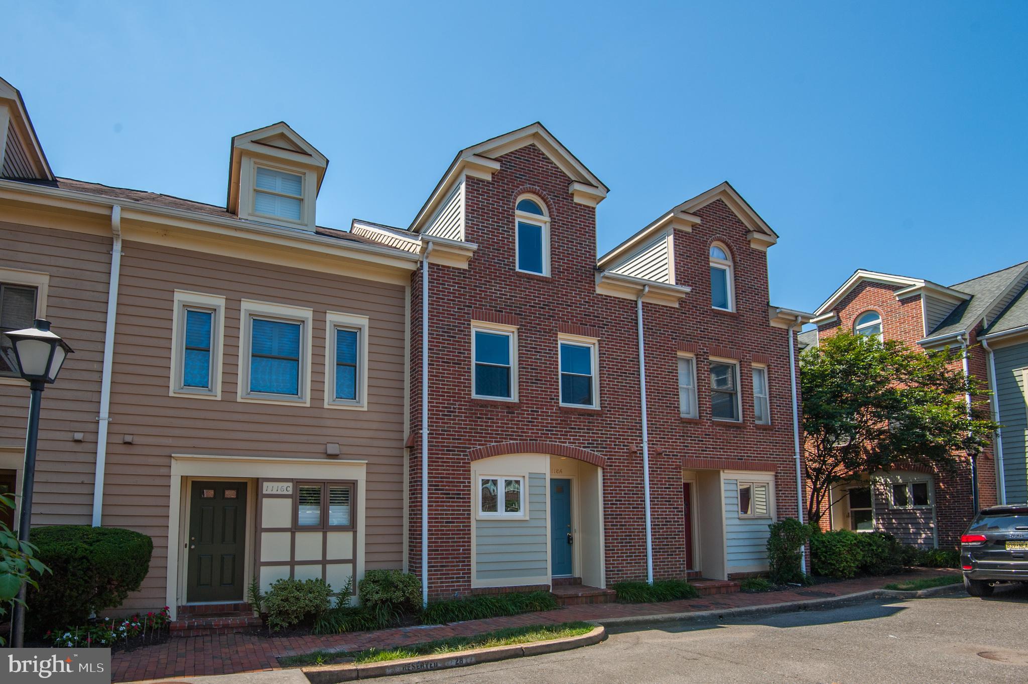 front view of brick house with a yard