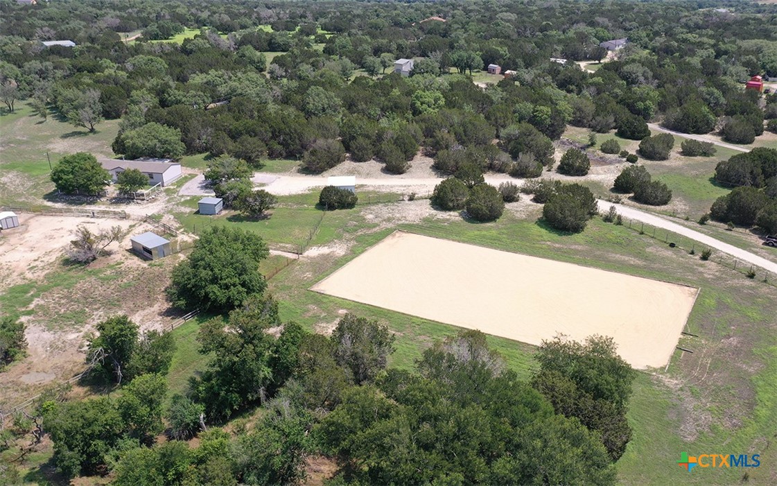 an aerial view of a house with yard swimming pool and outdoor seating